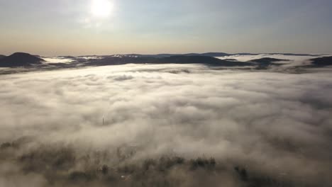 morning mist over the town of järvsö, sweden