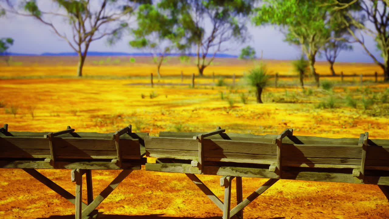 Desert landscape with wooden troughs under a clear sky showcasing nature