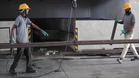 the workers are welding the metal