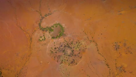spinning aerial over ancient meteor craters in desert