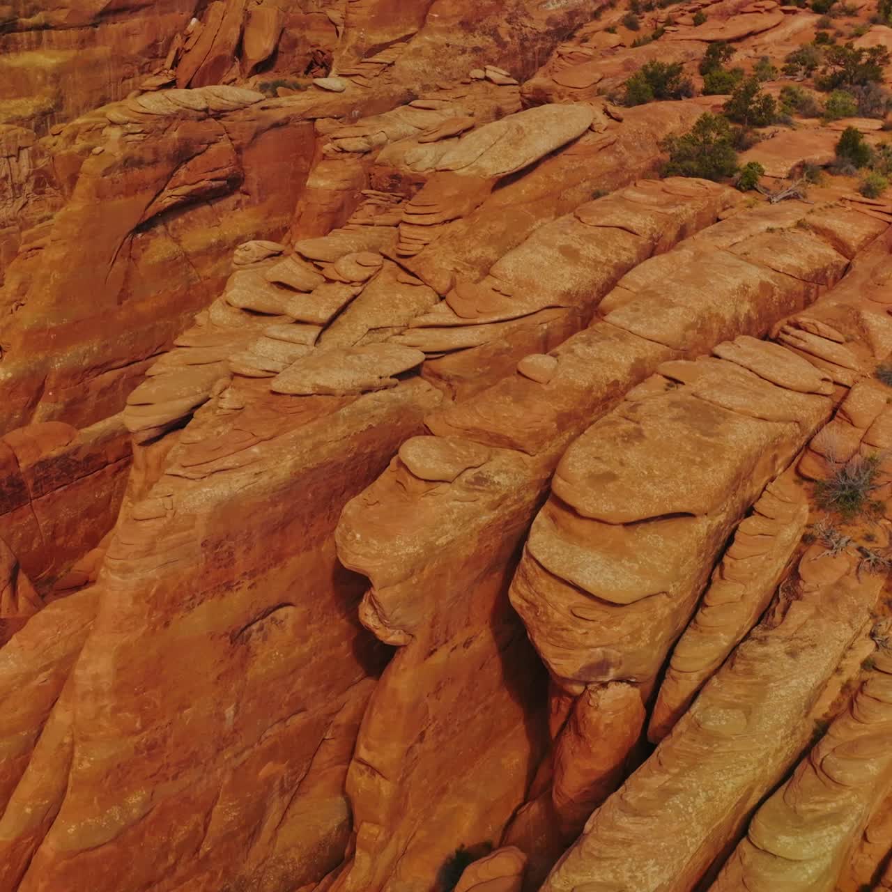 Geological formation in the Arches national Park in Utah, USA. Amazing bare rounded rocks in the shape of plates piled together. Top view