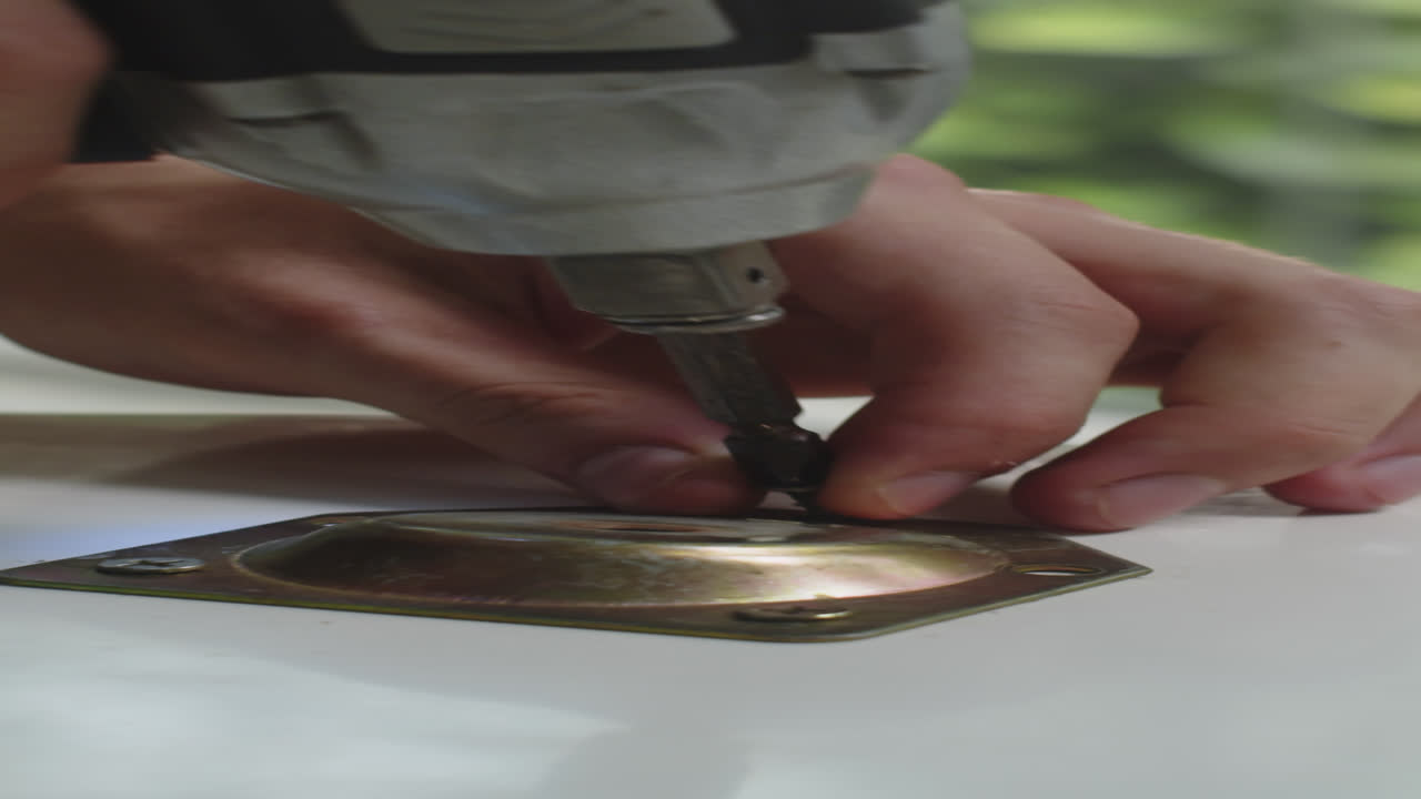 Person Using Drill when Assembling Table