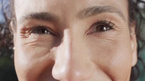 Close-up-portrait-of-female-biracial-basketball-player-eyes,-in-slow-motion