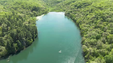 aerial shot of one corner of a lake deep in the forest mountains of wisconsin, usa