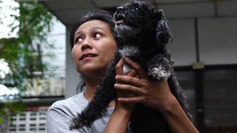 woman is resting with a dog at home