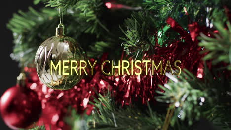 merry christmas text in yellow over decorations on christmas tree