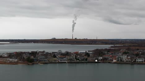 An-aerial-view-over-a-salt-marsh-on-a-cloudy-day-by-Freeport,-New-York