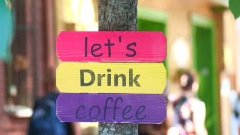 colorful wooden sign for coffee shop