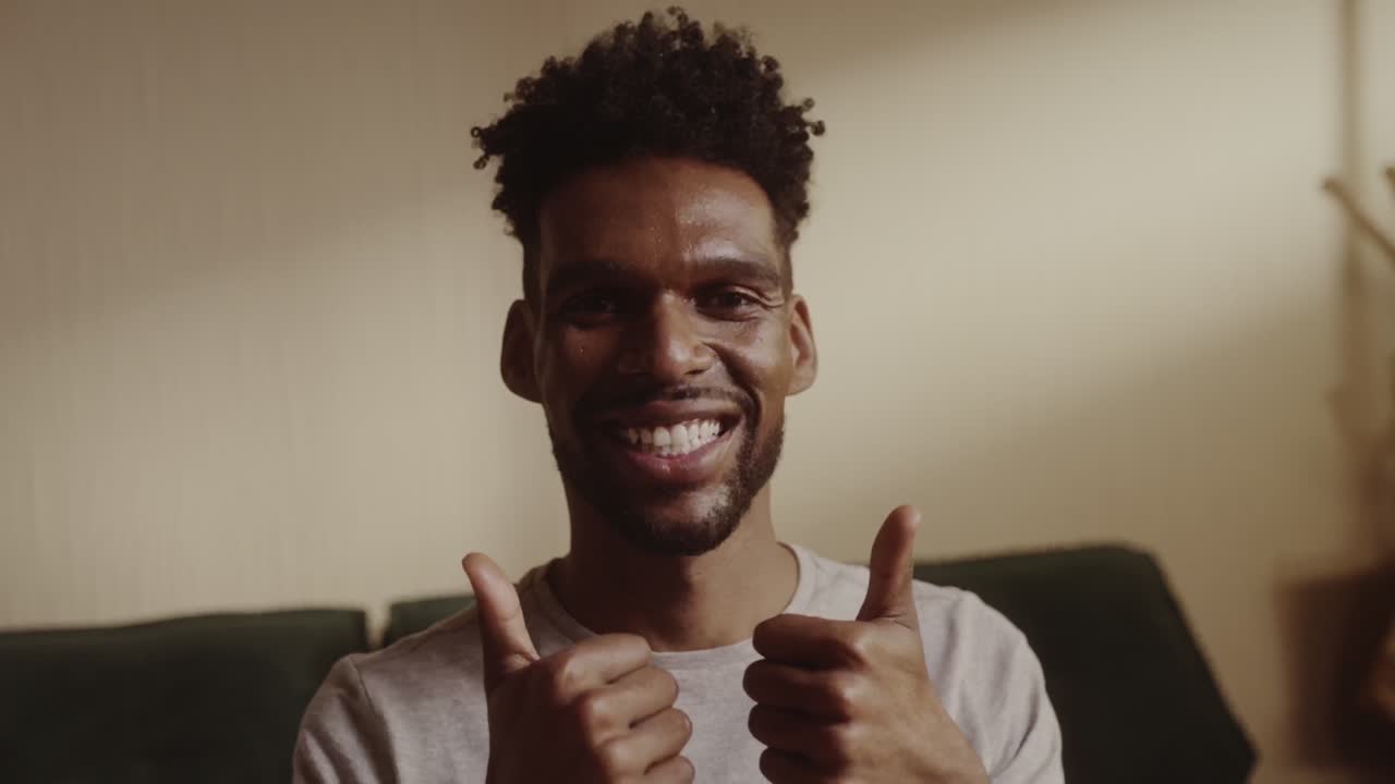 Happy man giving thumbs up