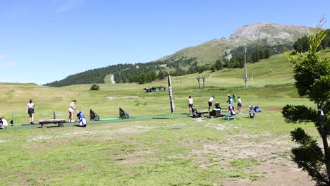 people practicing golf at scenic sestriere course