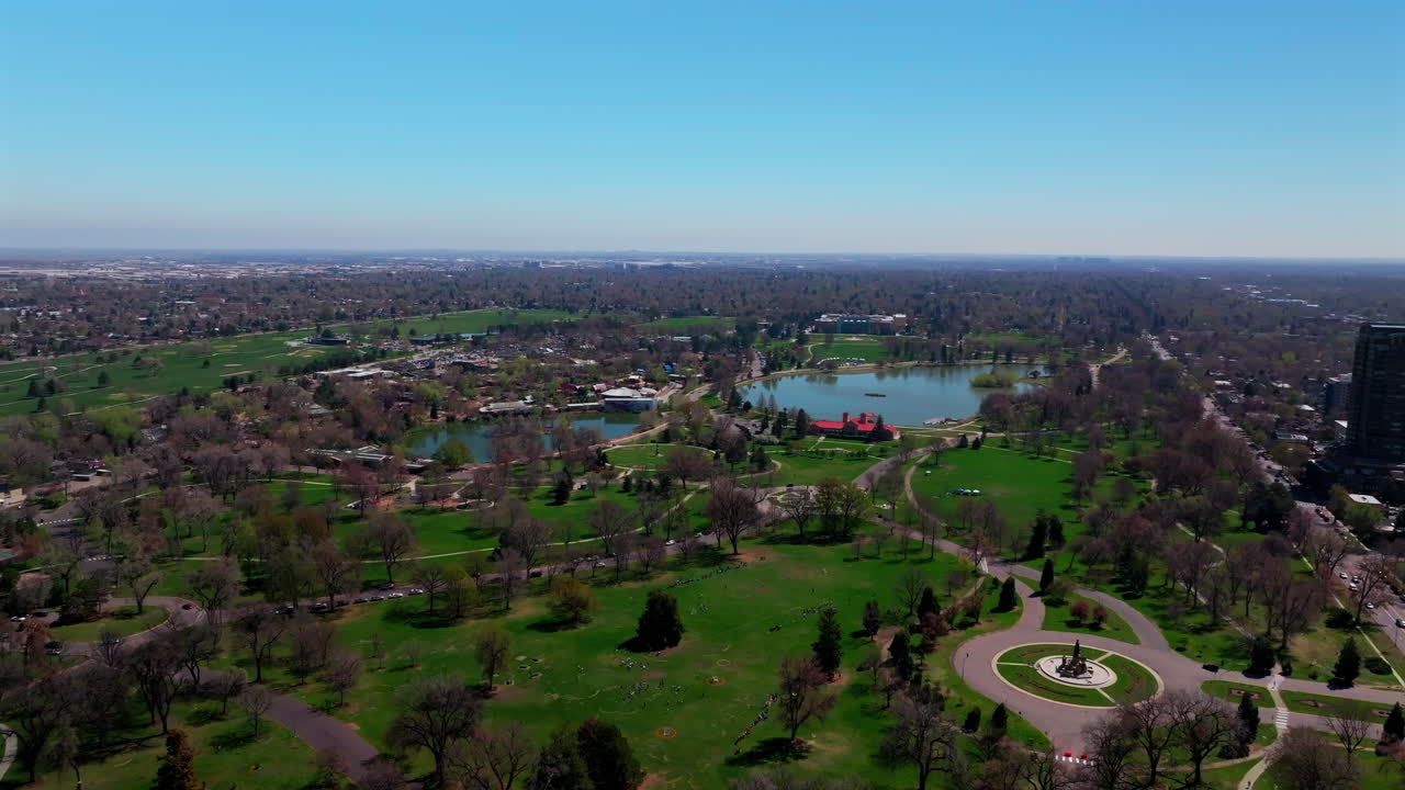 Denver Zoo Museum of Nature and Science City Park Golf Course spring downtown cityscape aerial drone Colorado green lush grass sunny blue skies morning neighborhood circle left motion