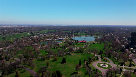 denver zoo museum of nature and science city park golf course spring downtown cityscape aerial drone colorado green lush grass sunny blue skies morning neighborhood circle left motion