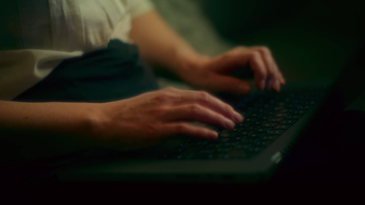 Nervous Woman Working Late On Laptop At Night