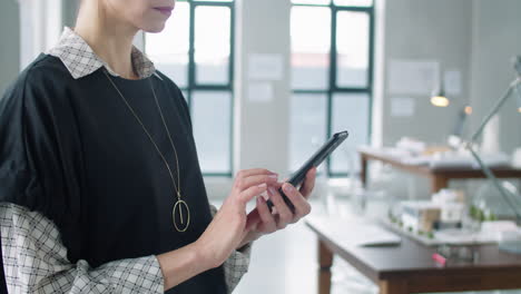 business lady typing on smartphone in office