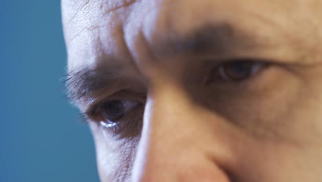 close-up sad eyes of mature man.