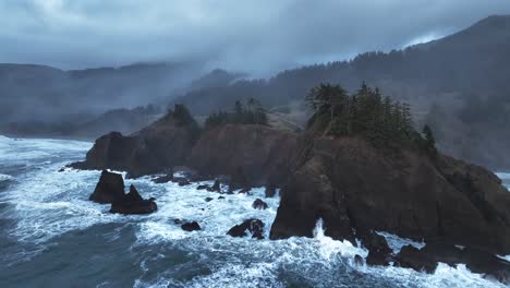 moody and foggy drone video of some jagged seastacks on the oregon coast with some fierce waves