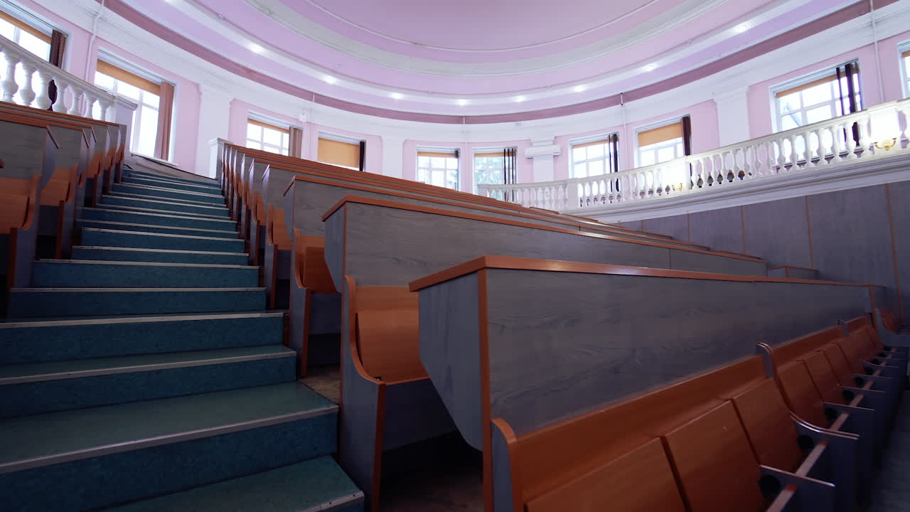 University classroom with chairs. Classroom lecture chairs with staircase in the middle of the class