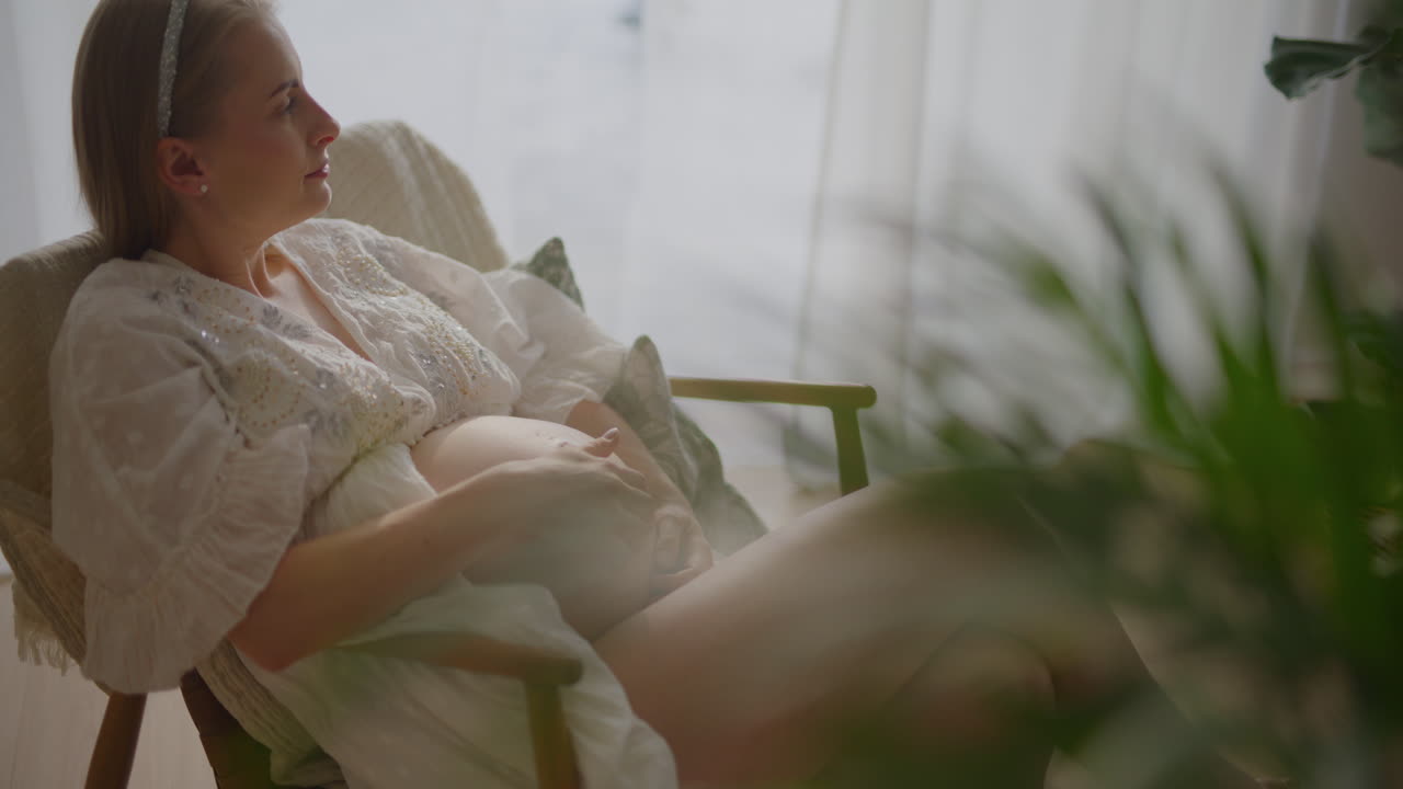 Pregnant Woman Sitting Comfortably in Chair