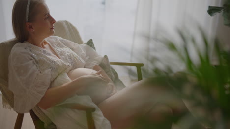pregnant woman sitting comfortably in chair