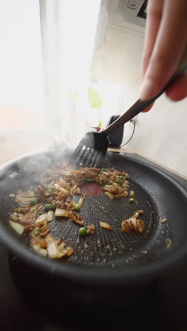 cooking stir-fry in a pan