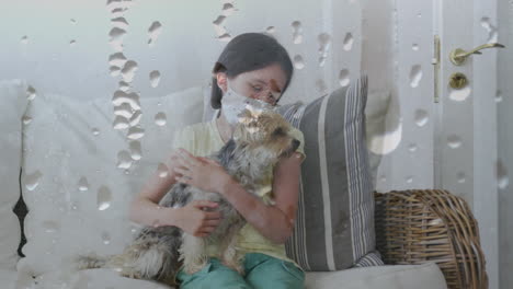 animation of waterdrops over caucasian girl wearing face mask holding her pet dog