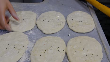 male hands making pita bread