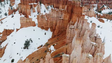 orange rocks of bryce canyon national park in winter in utah, usa - aerial drone shot