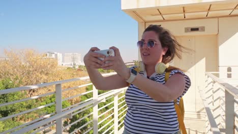 a young female tourist vlogging for social media upon arrival at destination