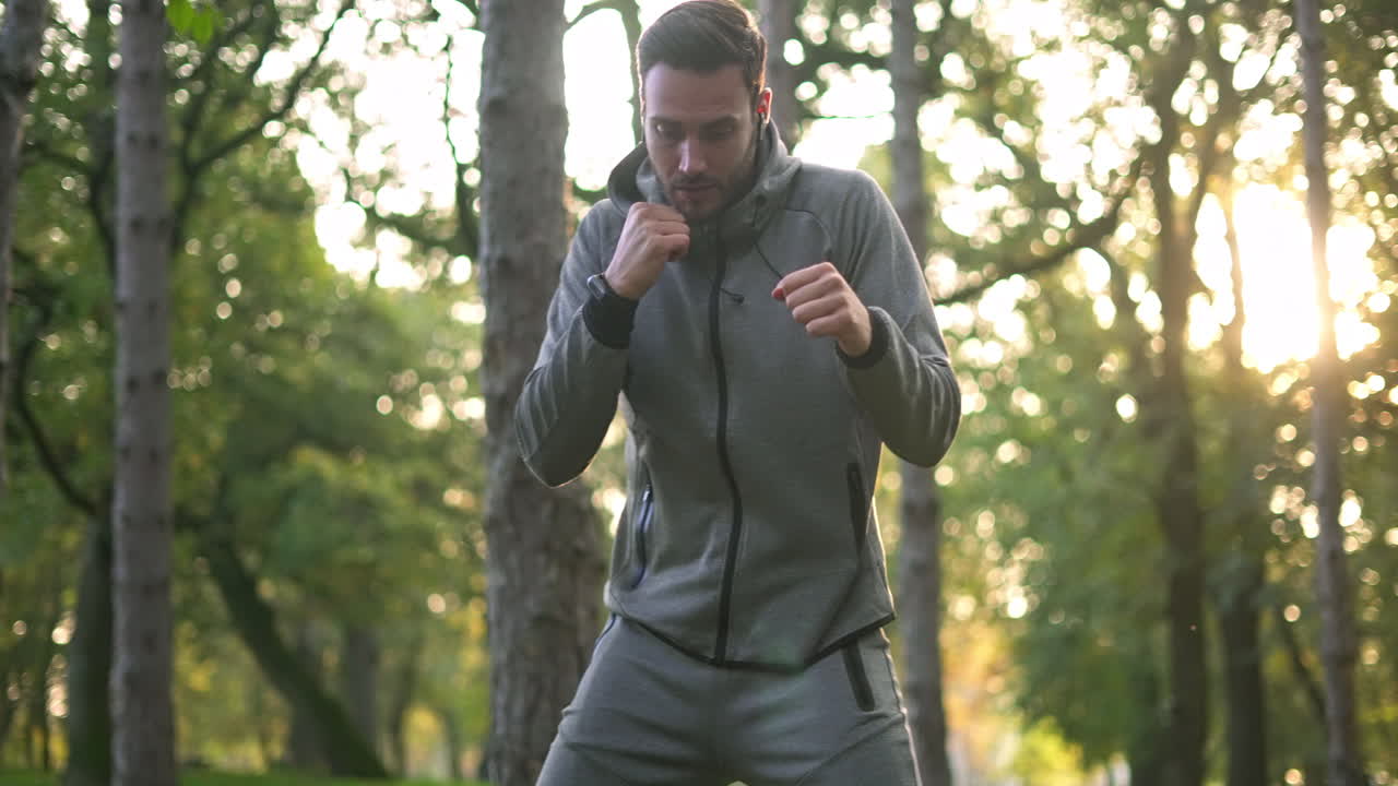 Man boxing in forest