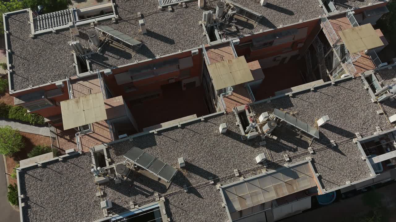 Aerial view of modern rooftop architecture in urban sunlight