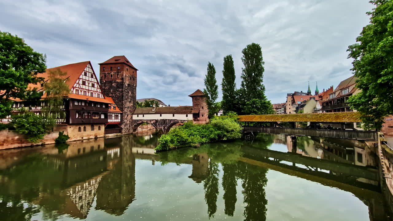 Henkersteg and Weinstadel in Nurnberg, Germany, with reflections on the Pegnitz River