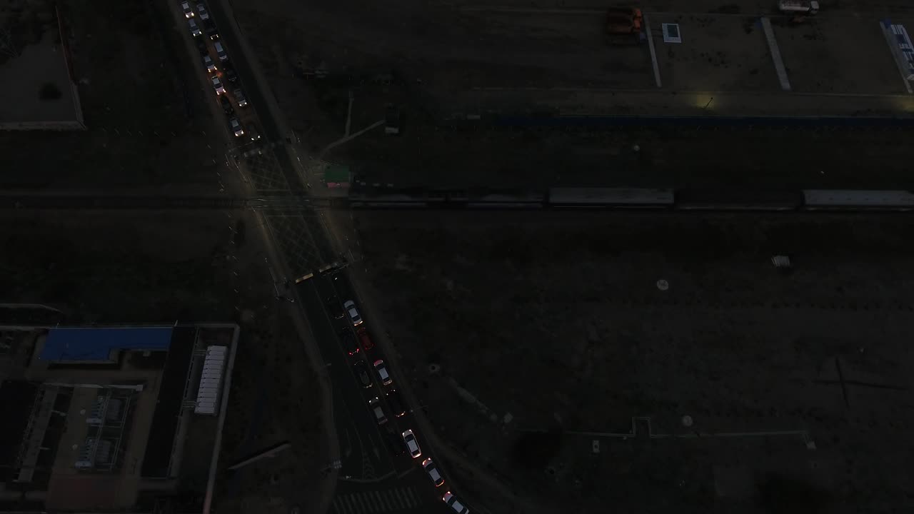 Aerial drone shot during night of a train crossing Ulanbator Mongolia