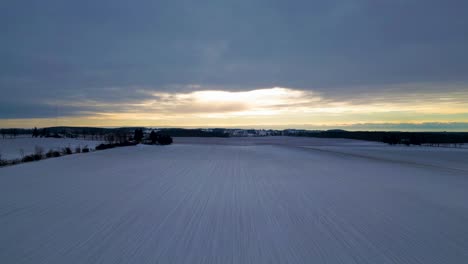 snow covered farm in london, canada, farm landscape with aerial drone view 60fps, sunrise and clouds trees and houses