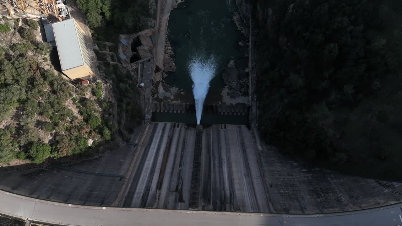 Top down aerial of large Dam and spillway water, low water conditions, Spain