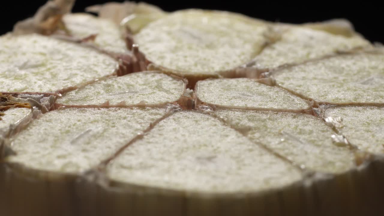 Bunch of garlic cloves cut in half. Macro close-up