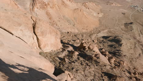 FPV-Drone-Flying-Through-Rocky-Desert-Hills-on-a-Sunny-Day