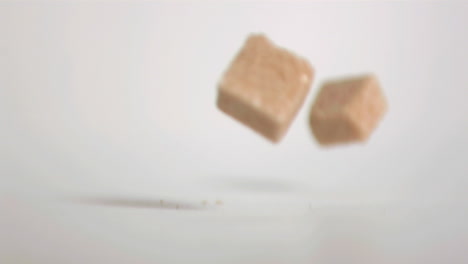 sugar cubes falling down in super slow motion