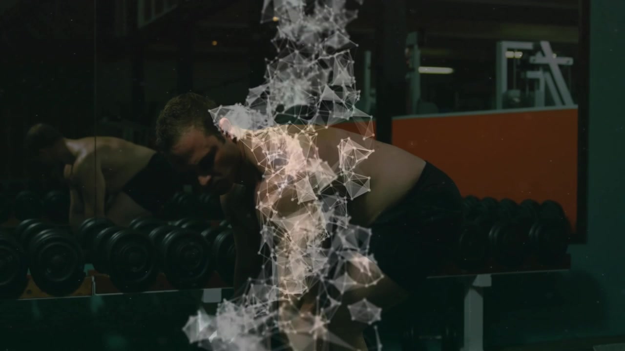 Man grabbing weight and doing bent-over rows in gym particle mesh deepening over torso for strength