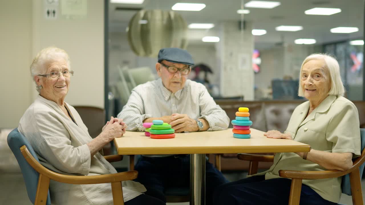 Seniors playing game at a table