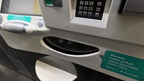 person using a ticket vending machine