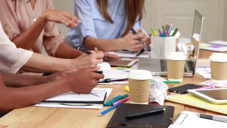 Mid-section-of-women-working-in-office