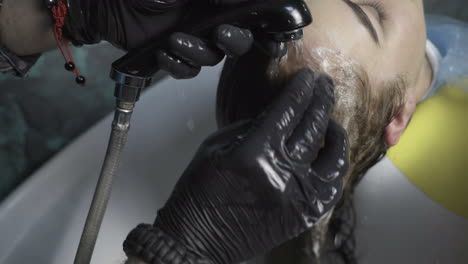 hairdresser dying female hair. woman client hair in beauty parlour hairdressing salon