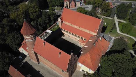 Flight-over-old-medieval-castle-in-a-Gothic-town-in-Europe