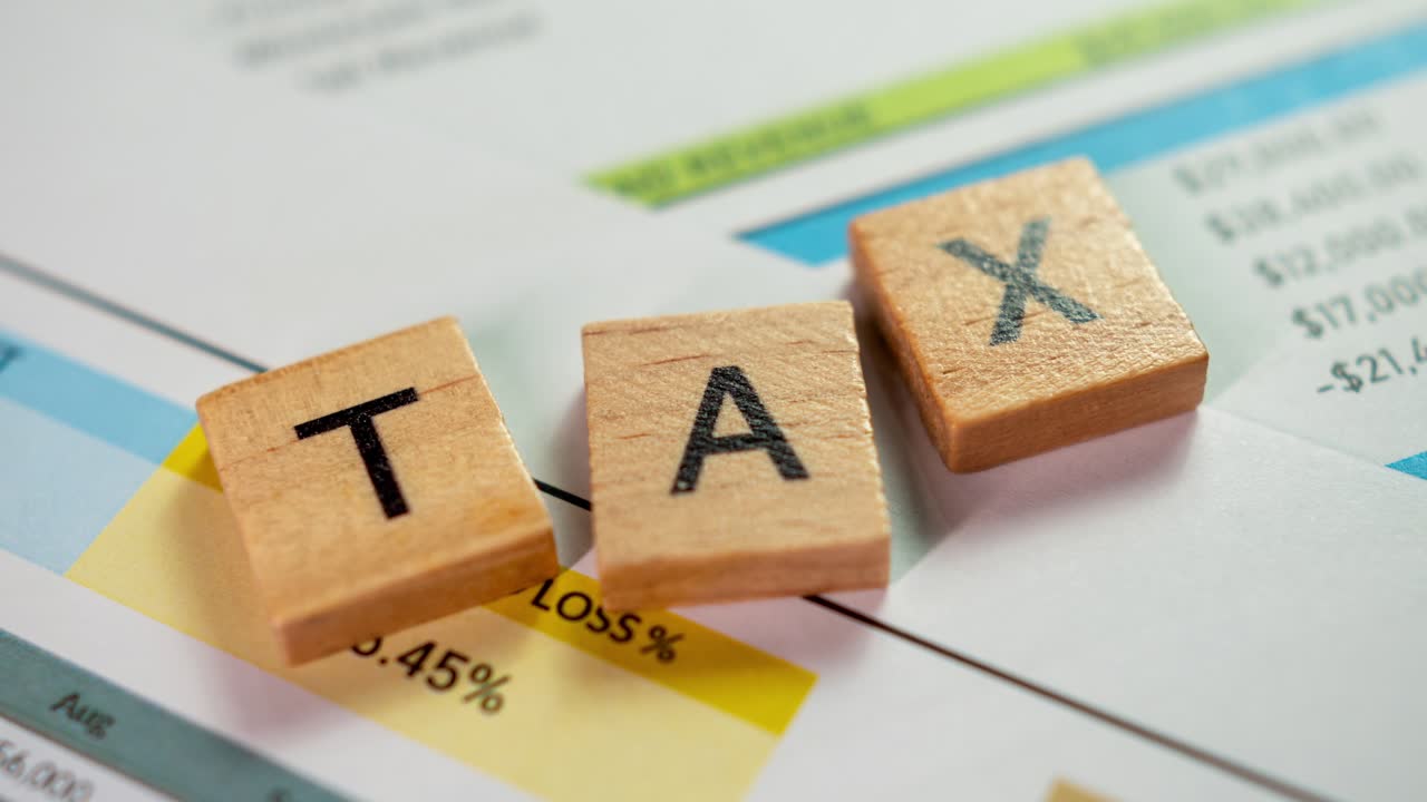 Explore effective tax strategies and financial planning insights for businesses in a professional office setting.