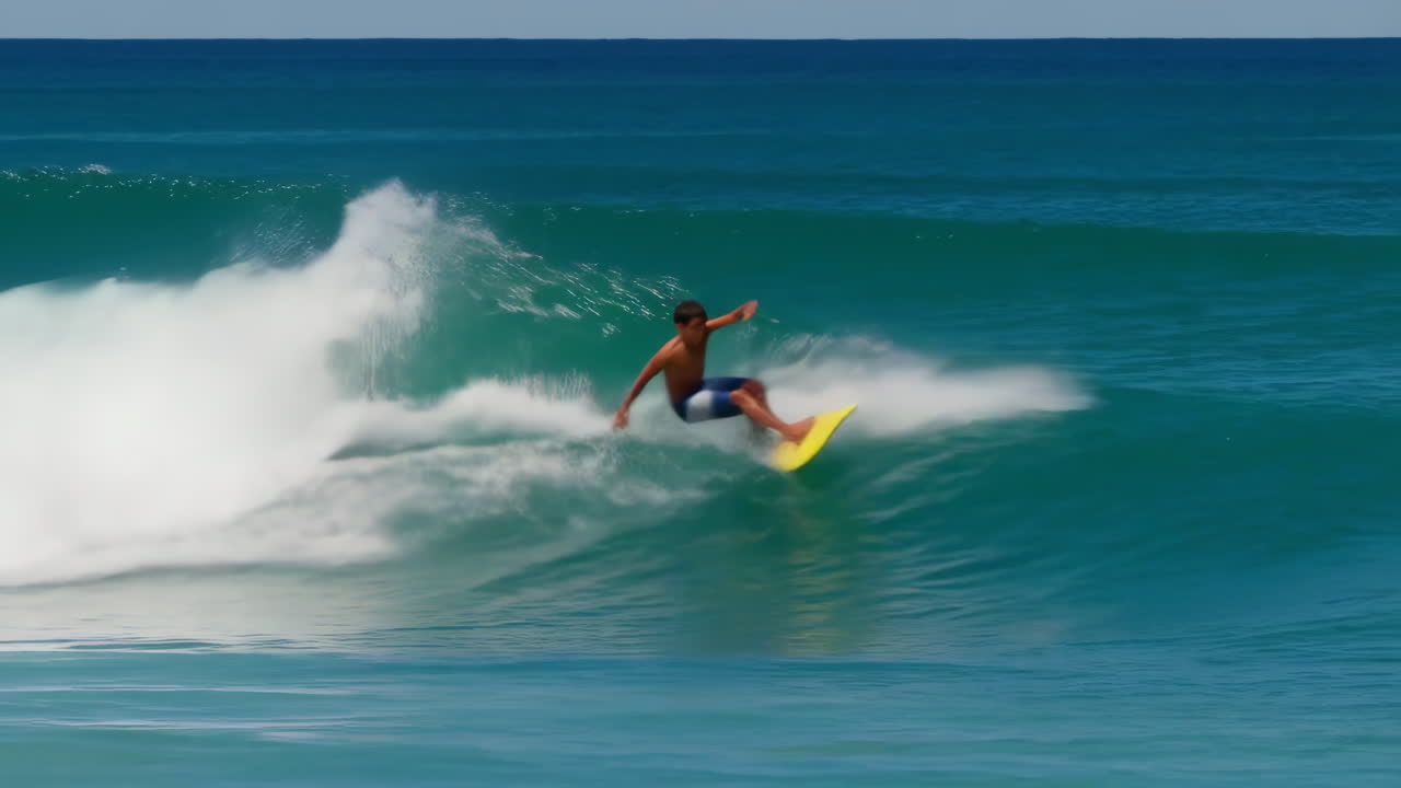 Young man surfing a wave in the ocean