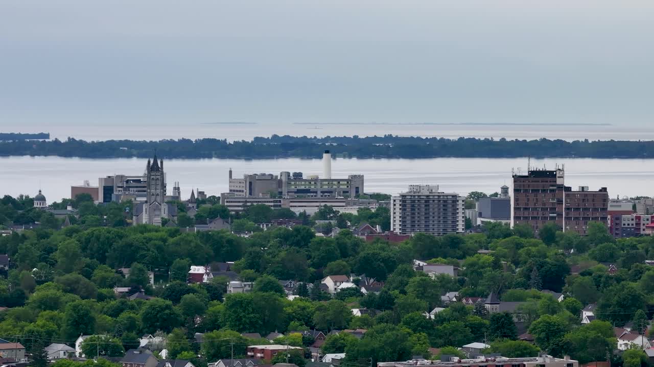 Panoramic Cityscape with Lush Green Trees and Waterfront