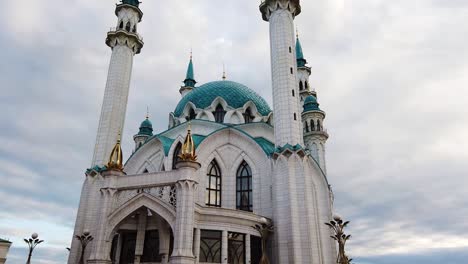 side pan view of qol sarif mosque in kazan, russia. panning upwards and revealing whole mosque and it's towers.