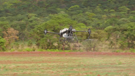 farming drone being used to spray in field