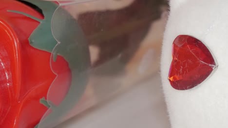 a close-up of a beautifully designed red rose in a transparent tube, perfect for valentine's day gifting