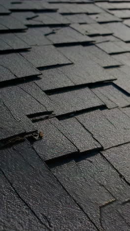 close-up of dark gray shingles on a roof